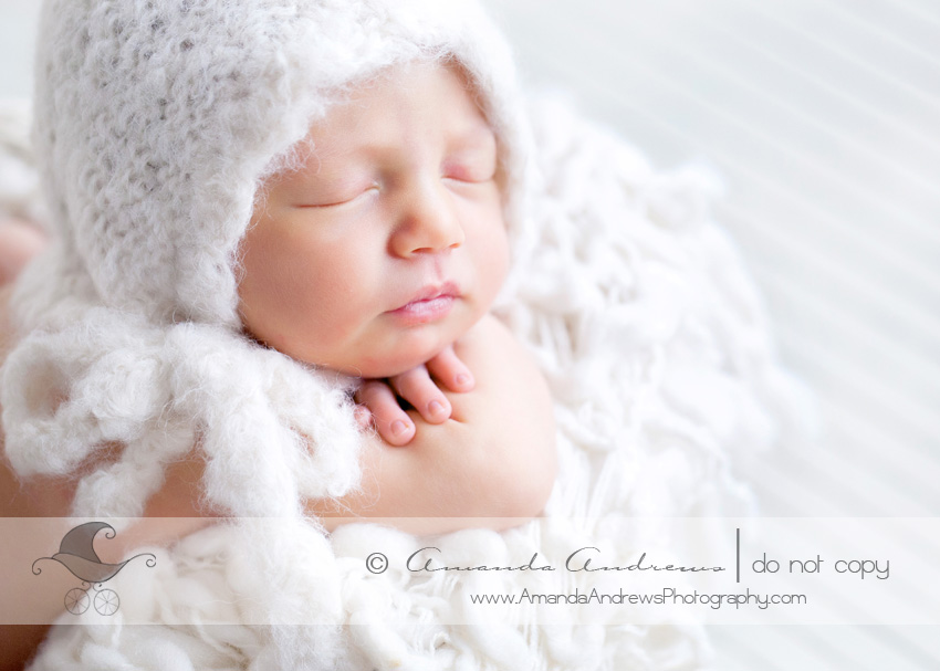 gwen's newborn pictures in bassinet 2