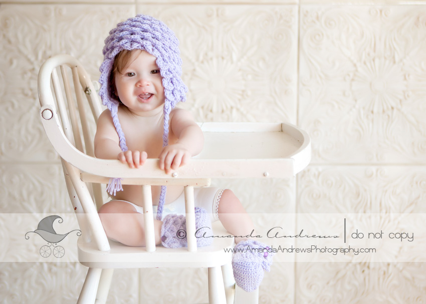 layla 8 months in highchair with hoernercornercrafts hat on