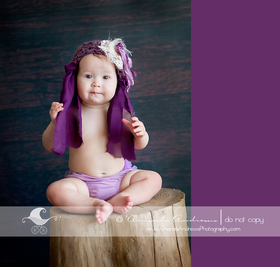 layla 8 months on tree stump with faas hat