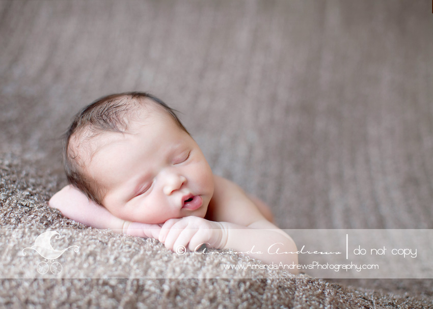 picture of baby sleeping on hands