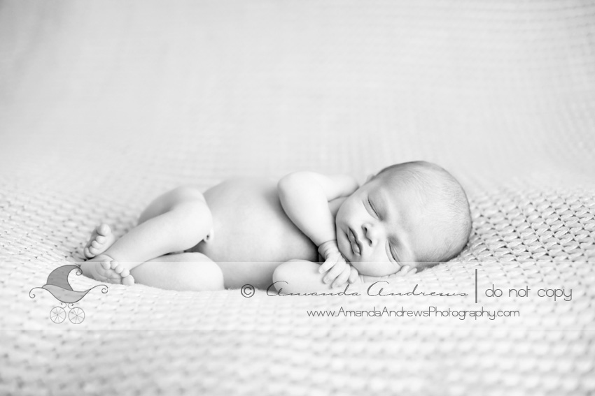 baby sleeping on blanket