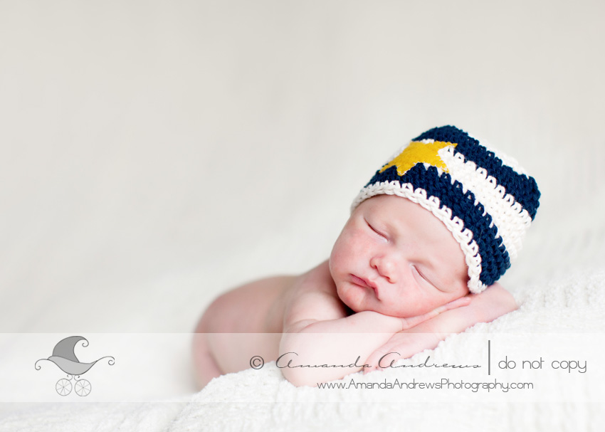 magic valley newborn baby photography charlie on white blanket with star hat newborn photograph
