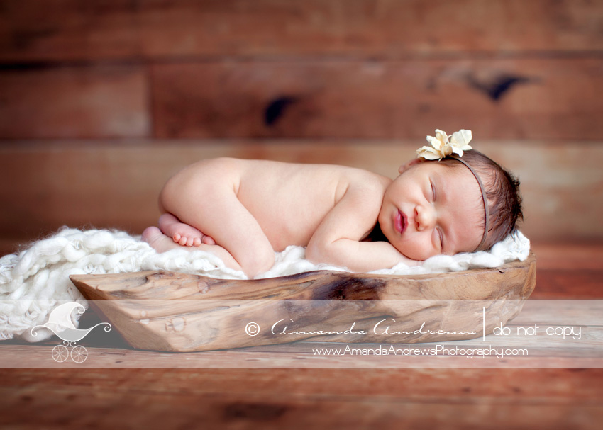 kaylee newborn photo on wood platter