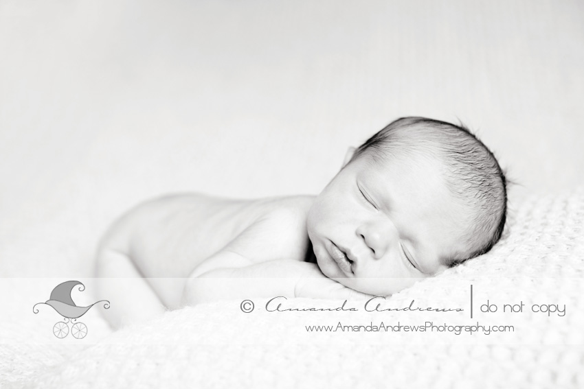 baby sleeping on blanket on bean bag photo