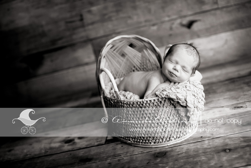 picture of baby in wicker bassinet