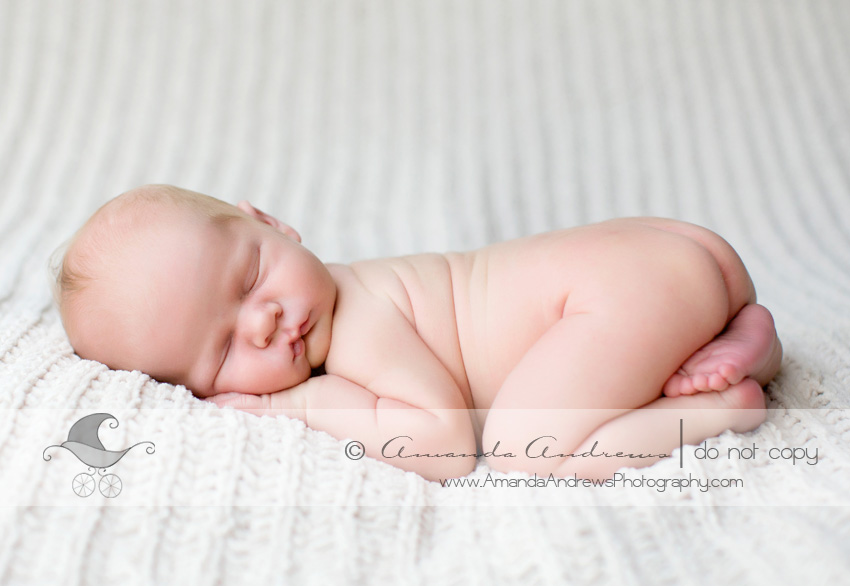picture of baby boy on white blanket