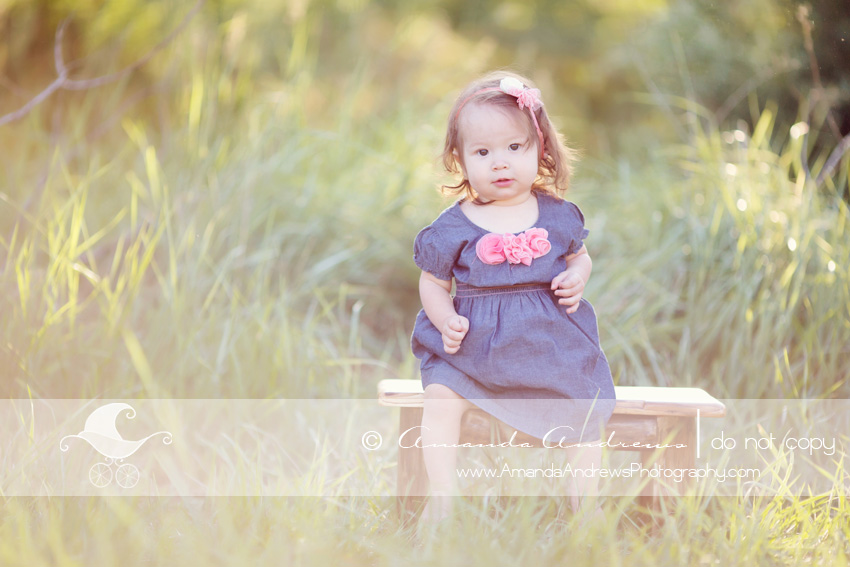 picture of baby girl on bench