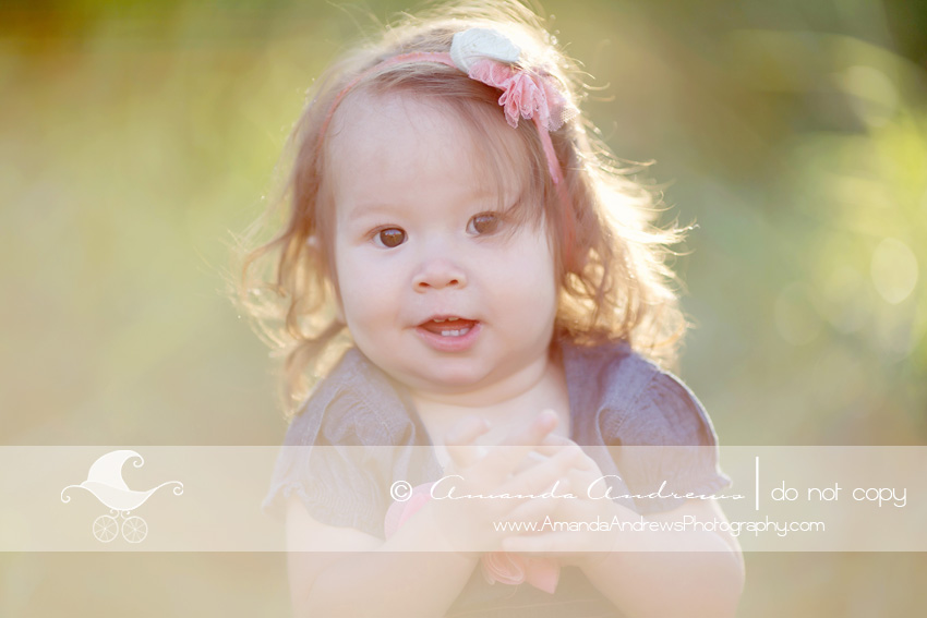 happy baby girl in blue dress