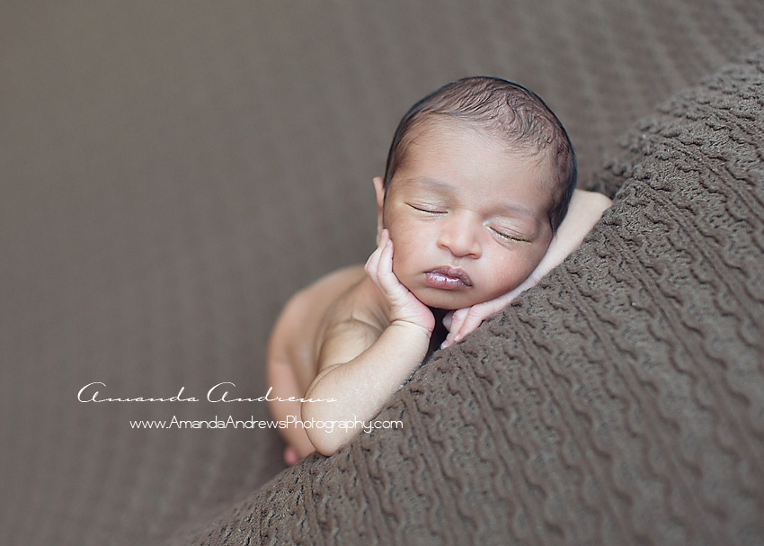 newborn boy sleeping on brown blanket boise photography
