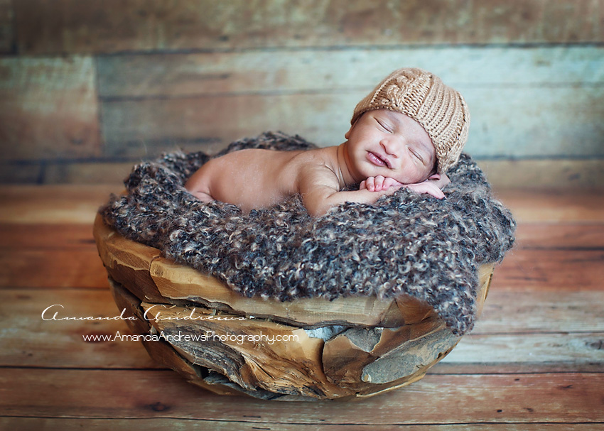 picture of baby in wood bowl