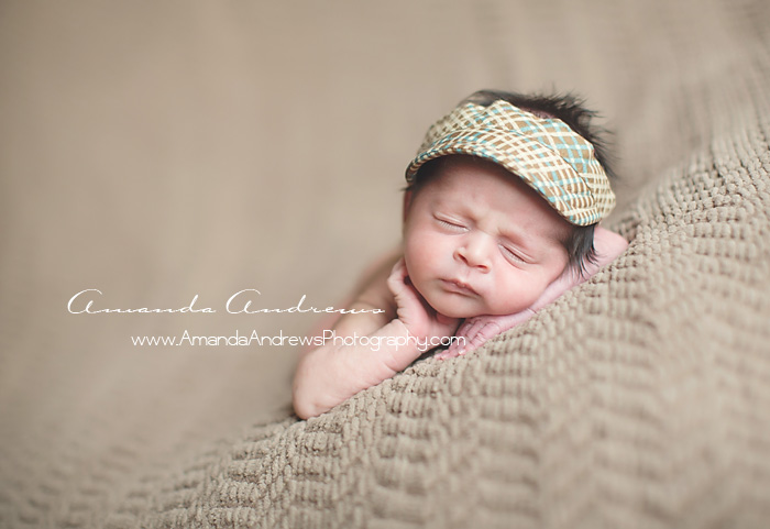 newborn sleeping with visor on