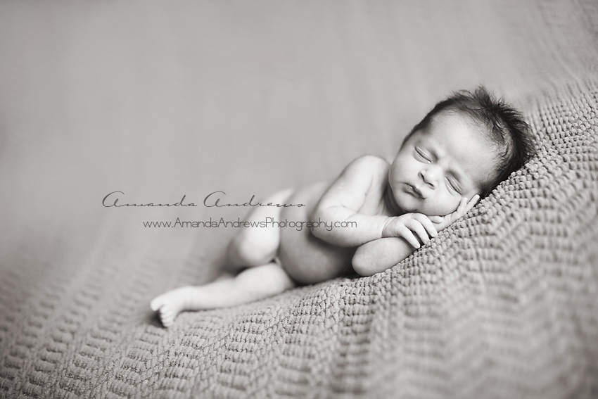 photo of sleeping infant stretched out