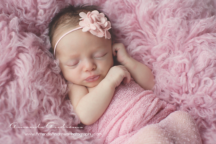 newborn sleeping on pink fur boise idaho