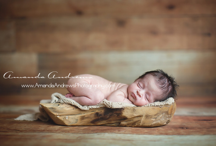boise infant asleep on piece of wood