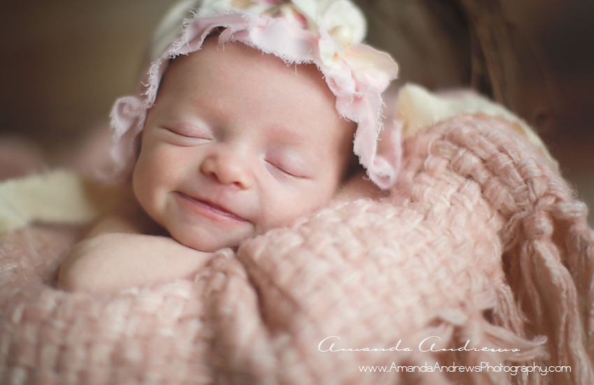 infant sleeping with smile