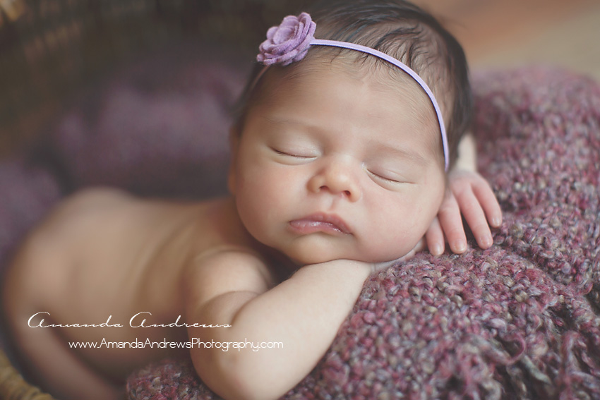 close-up photo of baby asleep on purple blanket boise