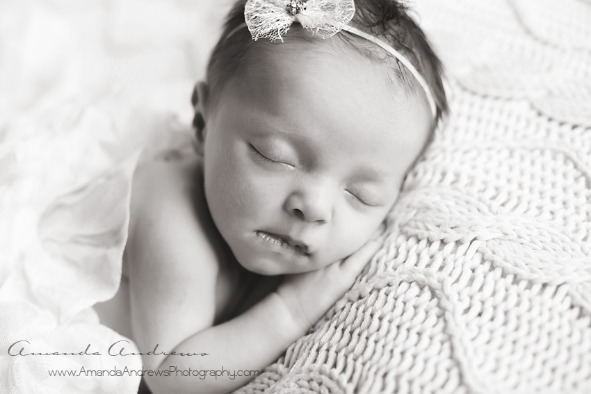 newborn sleeping with bow