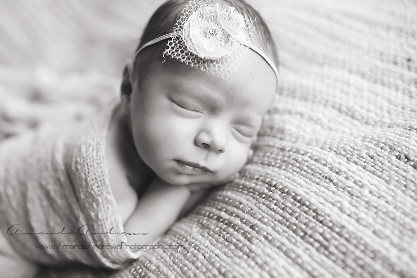 sleeping newborn girl in black and white