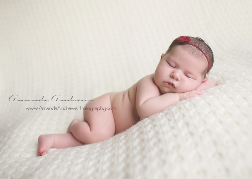 sleeping baby on white blanket