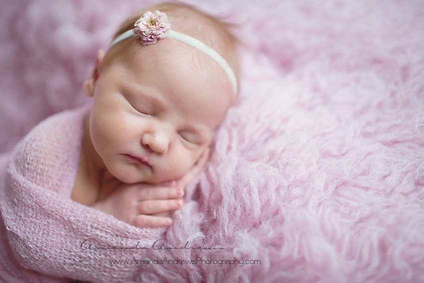 sleeping baby on pink fur boise