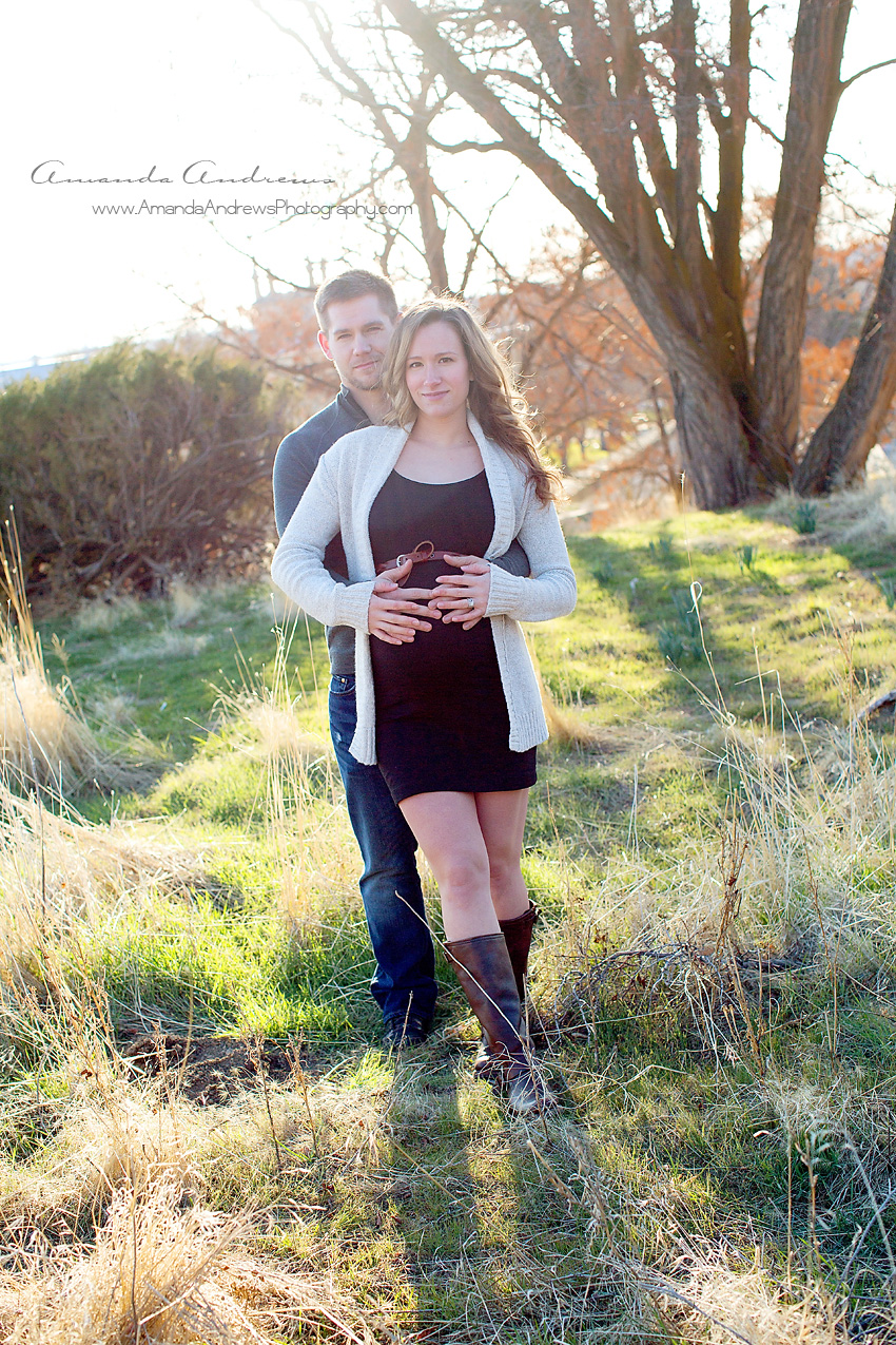 picture of pregnant woman with husband in field