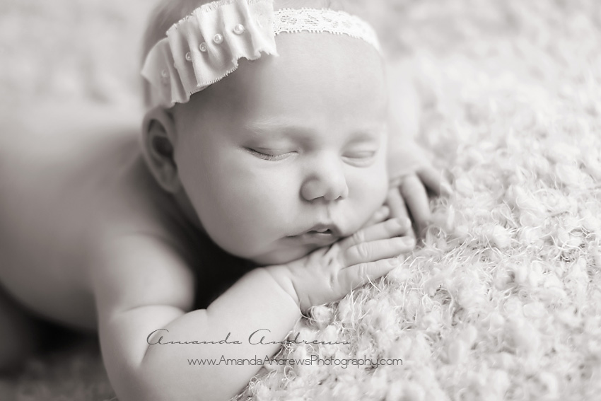 black and white photo of sleeping infant