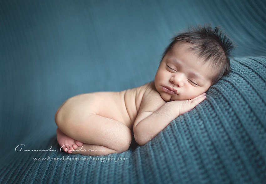 picture of baby sleeping on blue blanket