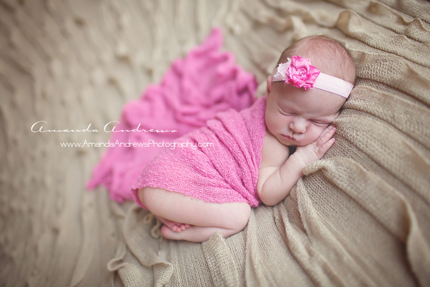newborn wrapped in pink