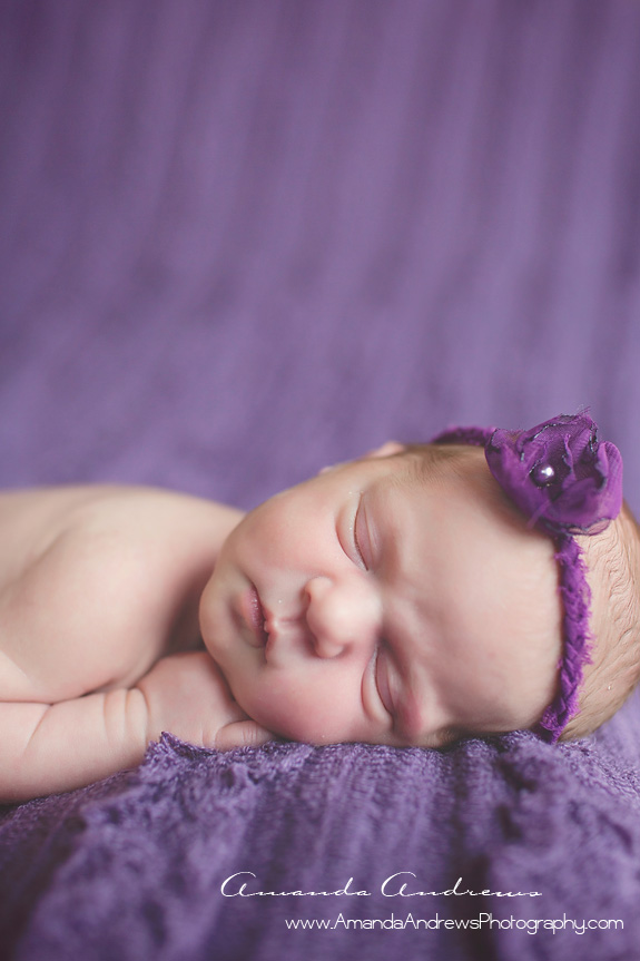 baby sleeping on purple