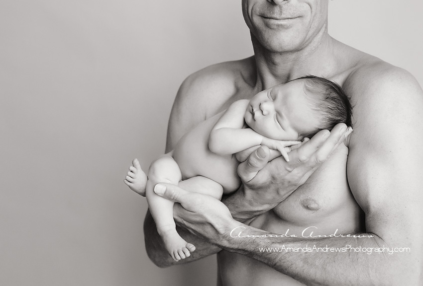 dad holding sleeping infant